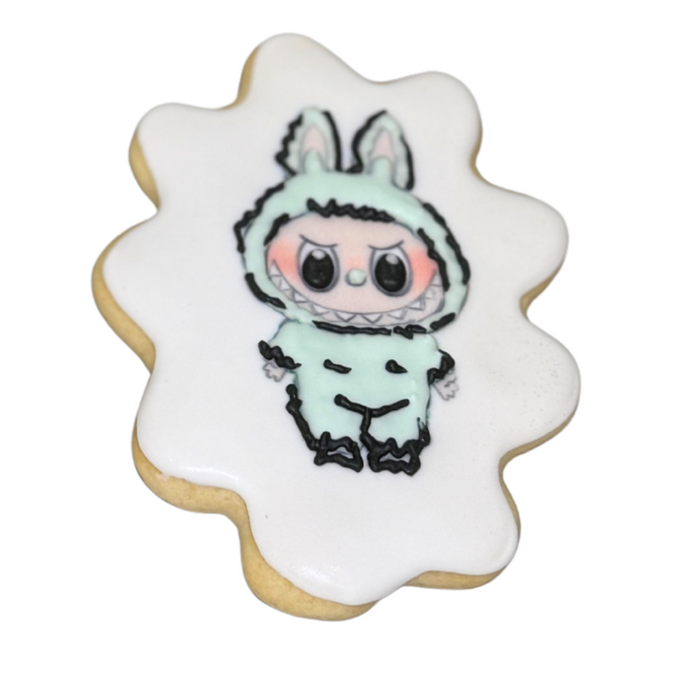The Monsters Cookie with a mint green monster design.