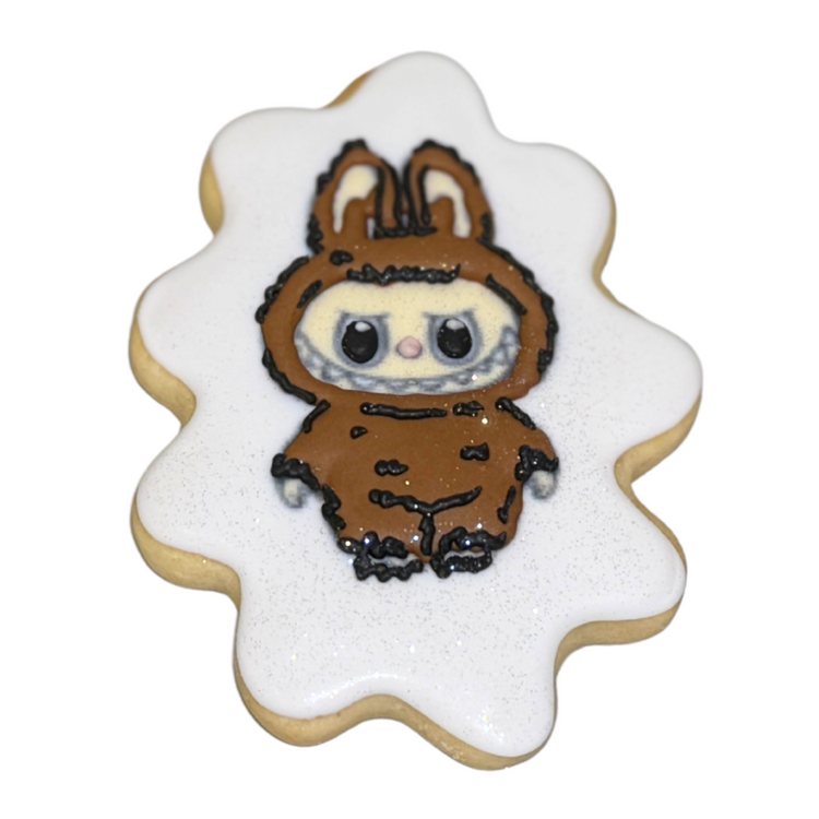 The Monsters Cookies shaped like a brown monster in a suit.