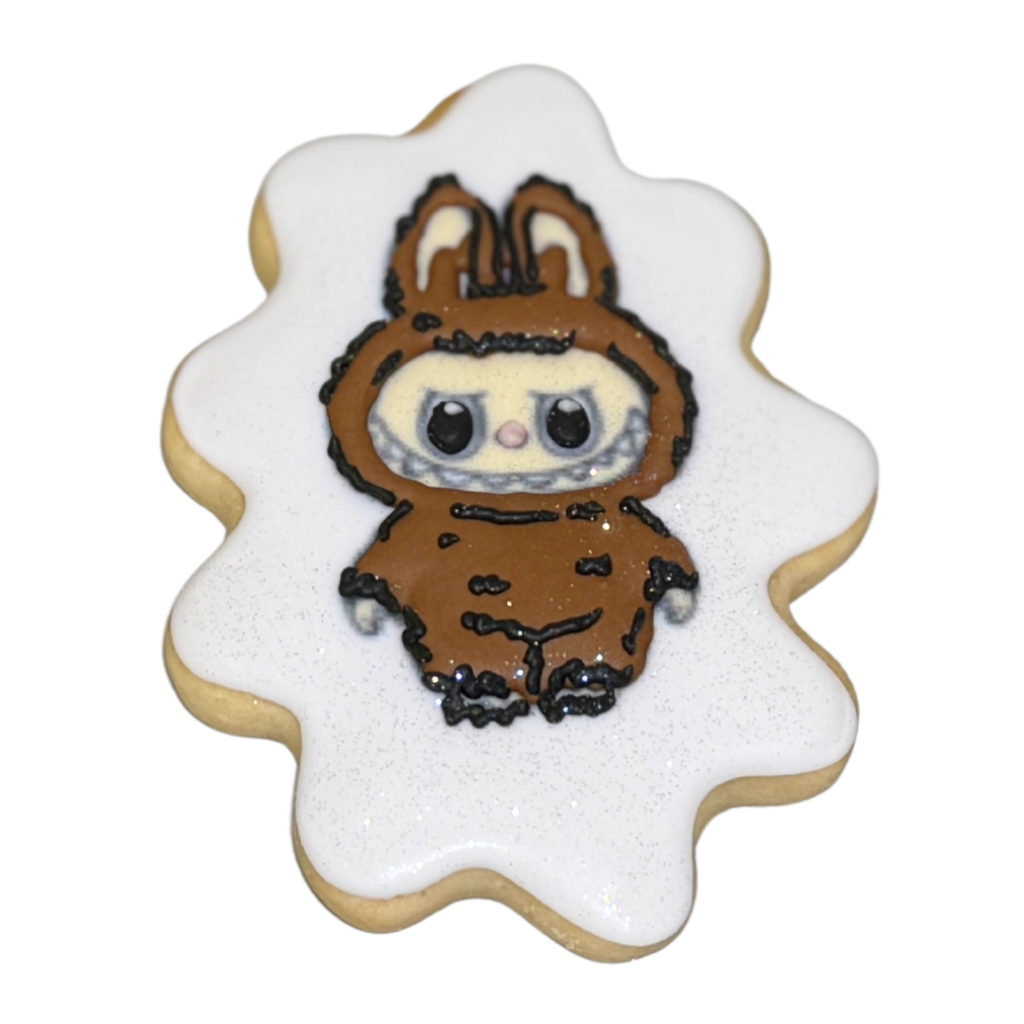 The Monsters Cookies shaped like a brown monster in a suit.