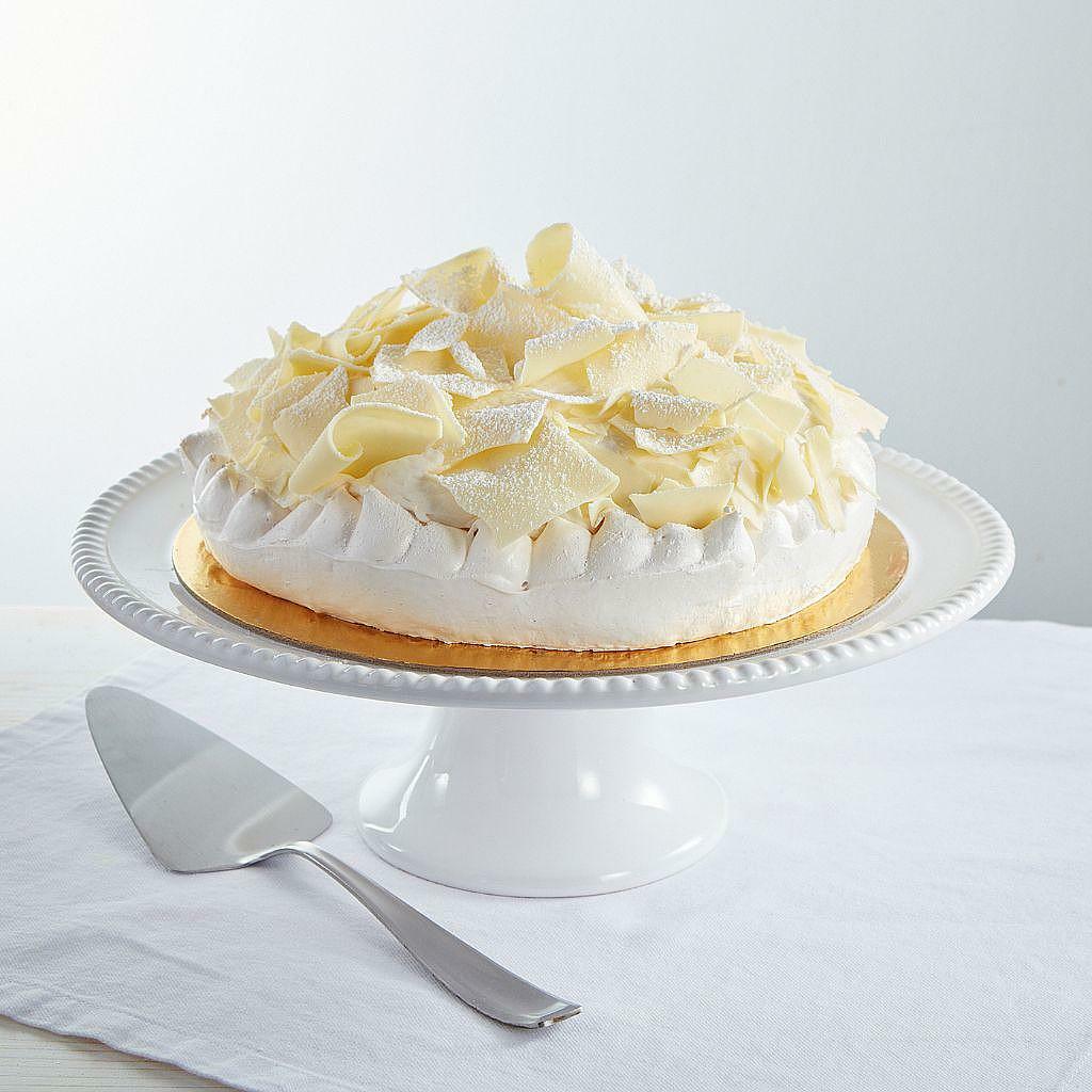 9-inch Lemon Vacherin GF topped with white chocolate curls.