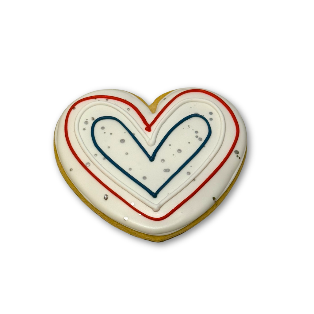 Memorial Day heart-shaped cookie with red and blue icing.
