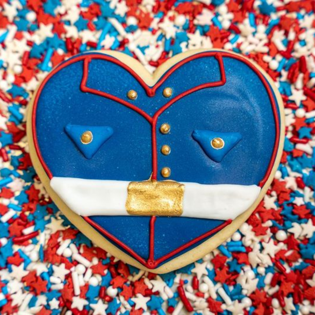 Heart-shaped Memorial Day cookie with military uniform icing.