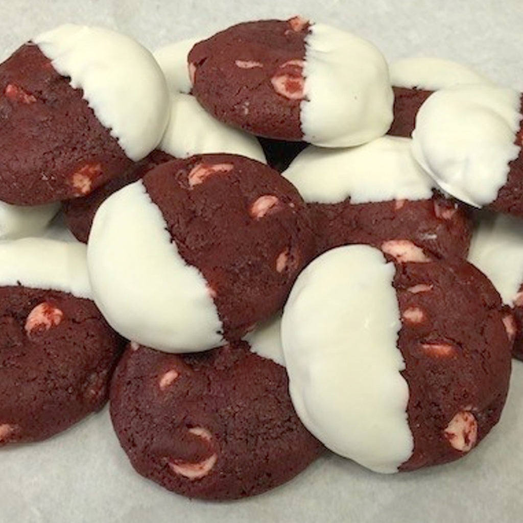 Miniature red velvet cookies dipped in white chocolate.