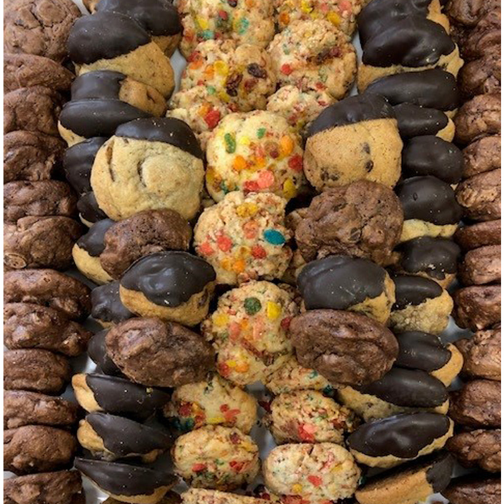 Assorted miniature cookies with chocolate-dipped and confetti styles.