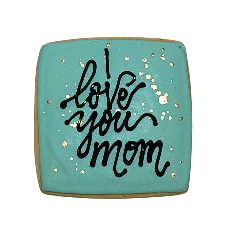 Square Mother's Day cookie with teal icing and gold flecks.