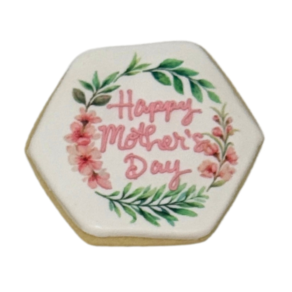Hexagonal Mother's Day cookie with pink floral wreath design.