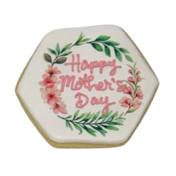 Hexagonal Mother's Day cookie with pink floral wreath design.