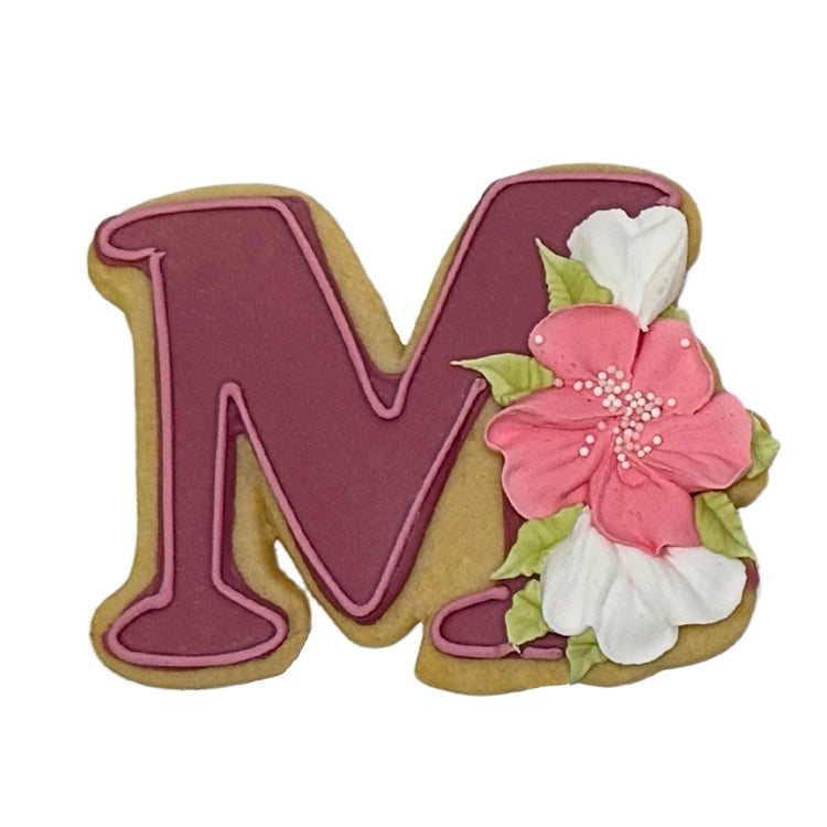 Mother's Day letter M cookie with pink and white floral icing