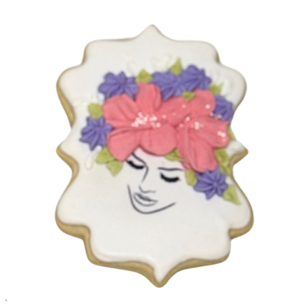Mother's Day cookie with floral woman portrait icing.