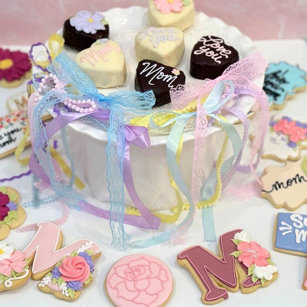 Mother's Day heart-shaped cookies on a white cake stand