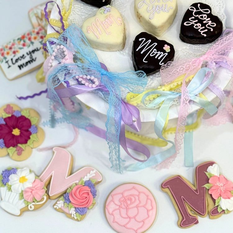 Mother's Day Petit Four Hearts decorated with pastel ribbons.