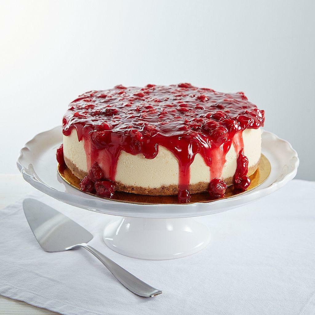 9-inch New York cheesecake topped with red cherry glaze.
