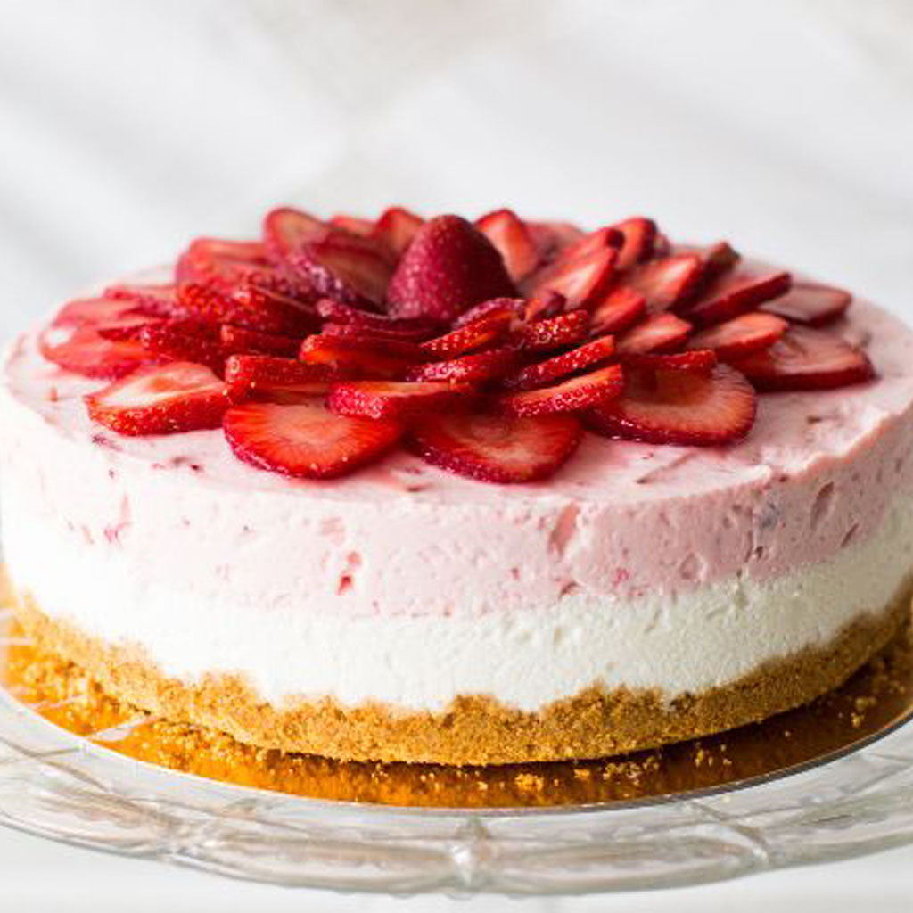 9-inch Chosen Cheesecake topped with fresh strawberry slices.