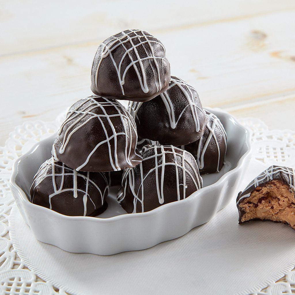 6-pack of GF peanut butter truffles drizzled with white icing.