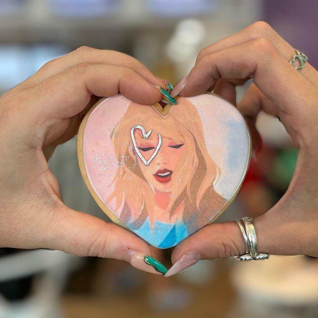 Taylor Swift heart portrait cookie held in hands