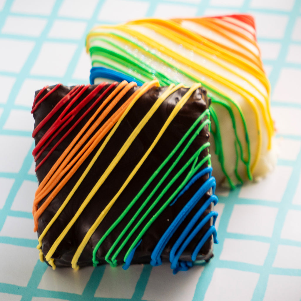 Pride Petit Fours with rainbow-striped chocolate icing.