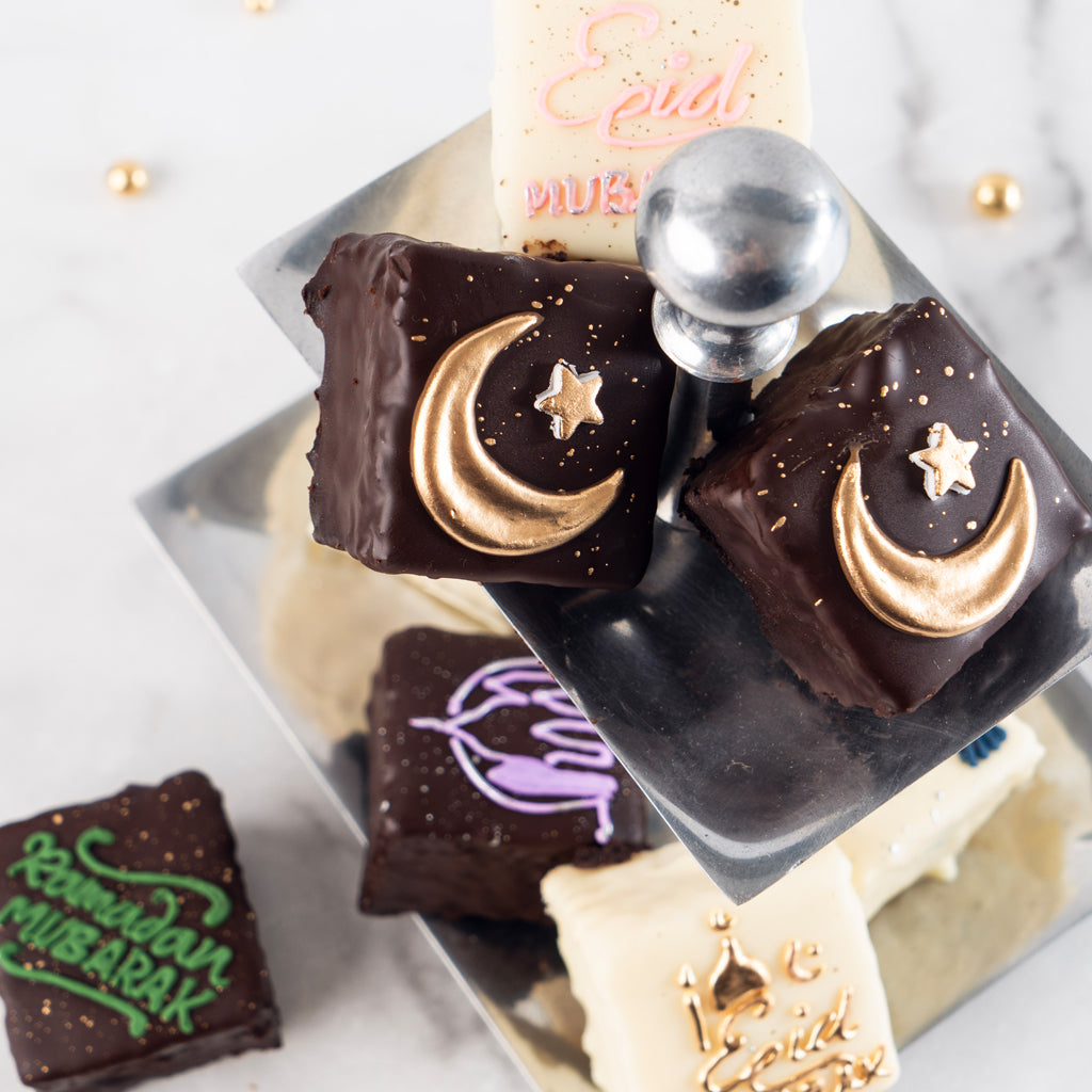 Ramadan & Eid petit fours with gold moon and star decorations.