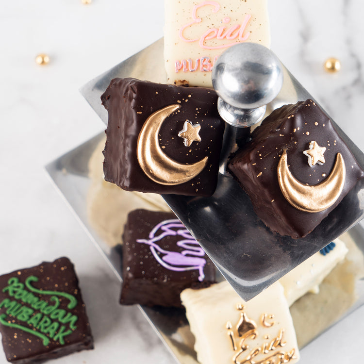 Ramadan & Eid petit fours with gold moon and star decorations.