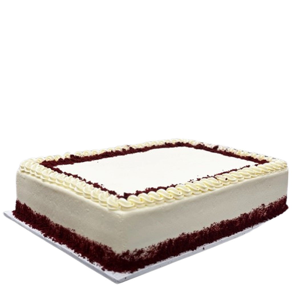 Red velvet sheet cake with white frosting and red crumb border.