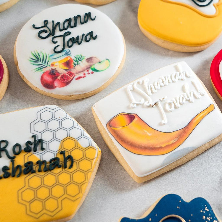 Assorted Jewish High Holidays cookies with festive icing designs.