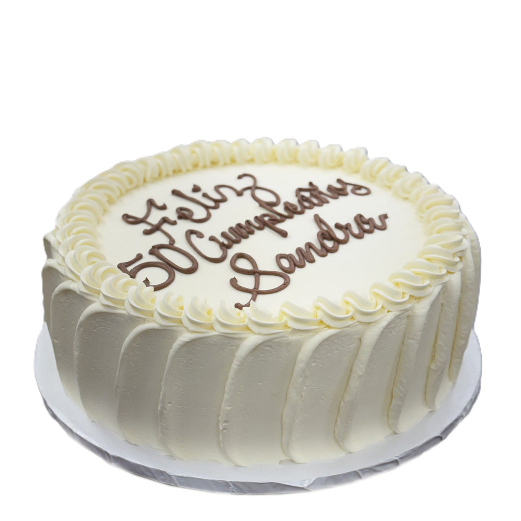 French vanilla cake with white frosting and brown lettering.
