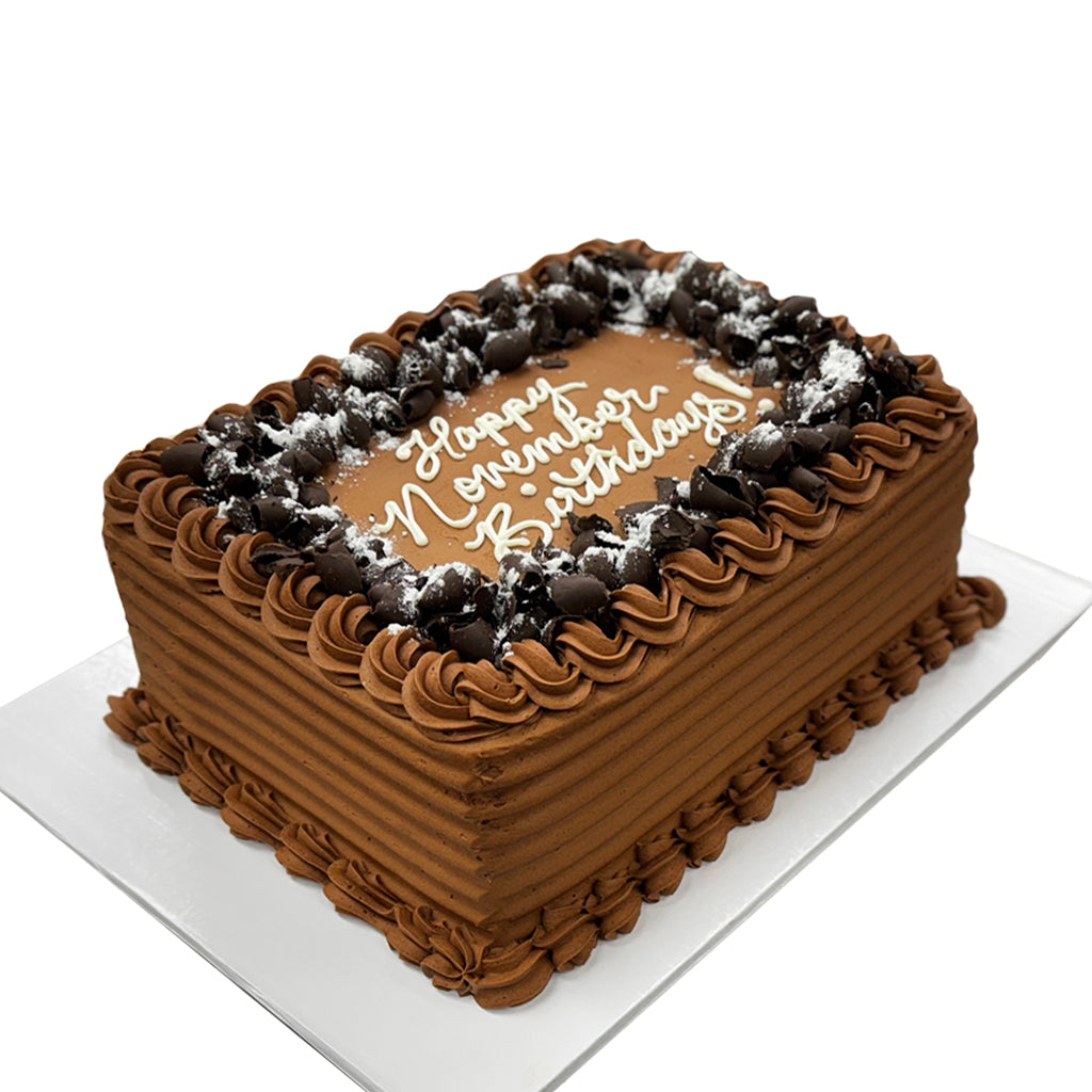 Mom's Chocolate sheet cake with chocolate curls and frosting.