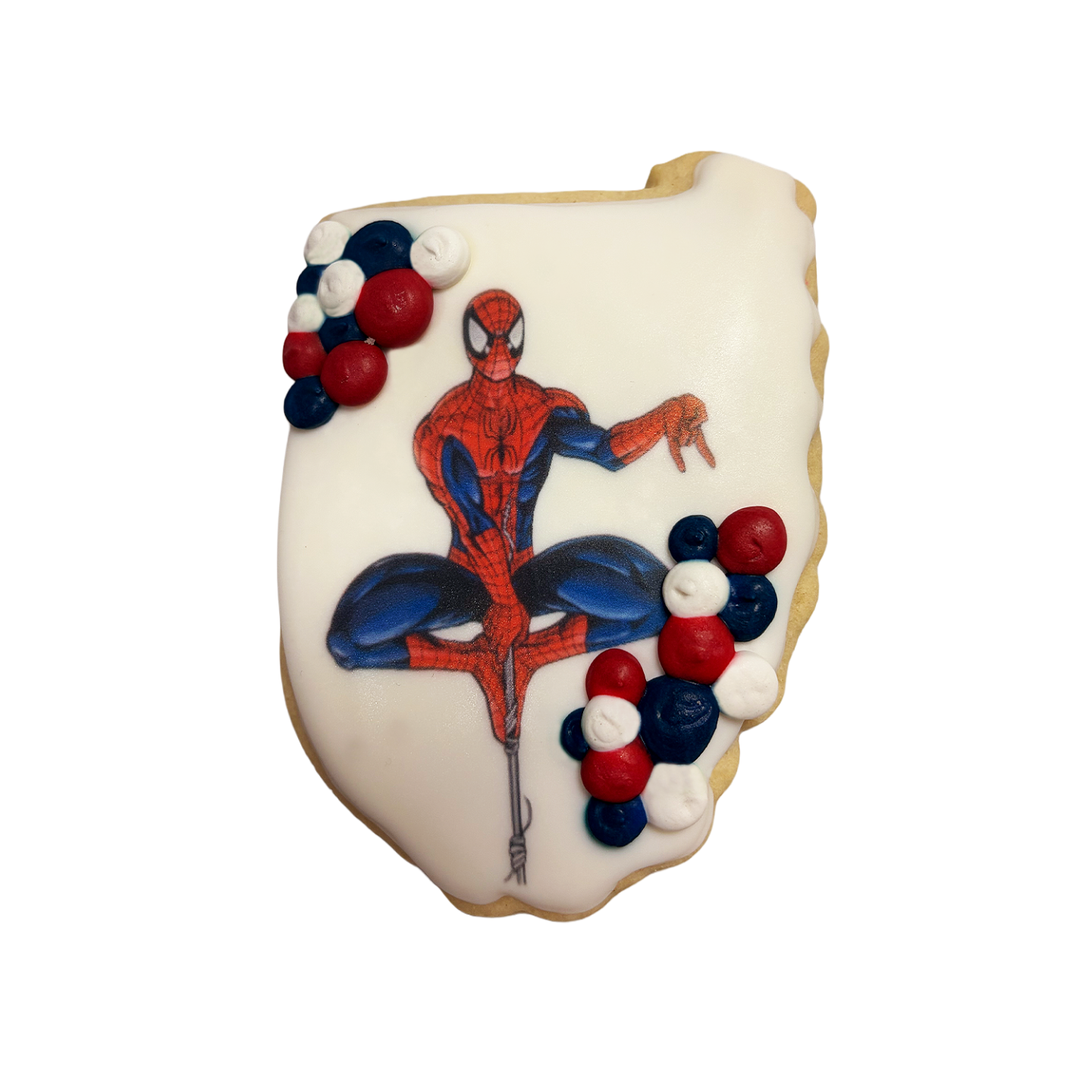 Spiderman cookie with red, white, and blue icing accents.