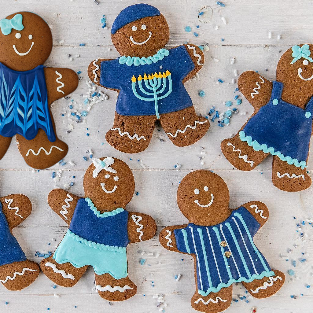 Hanukkah GingerPeople cookies decorated with blue icing.