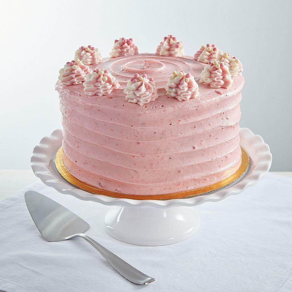 9-inch Strawberry Dream Cake with pink frosting on a cake stand.