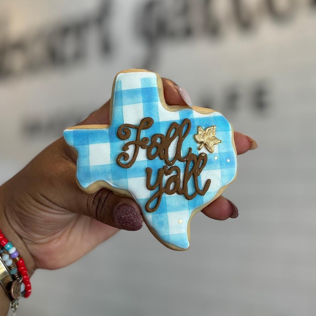 Texas-shaped Fall butter cookie with blue gingham icing.