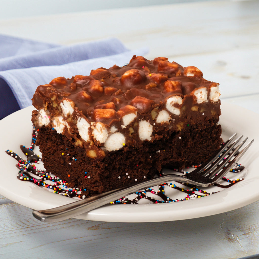 Rocky road brownie topped with marshmallows on a plate