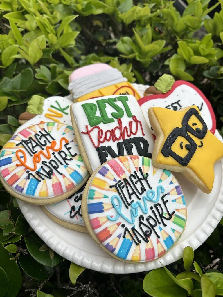 Teacher appreciation cookies with pencil and apple designs.
