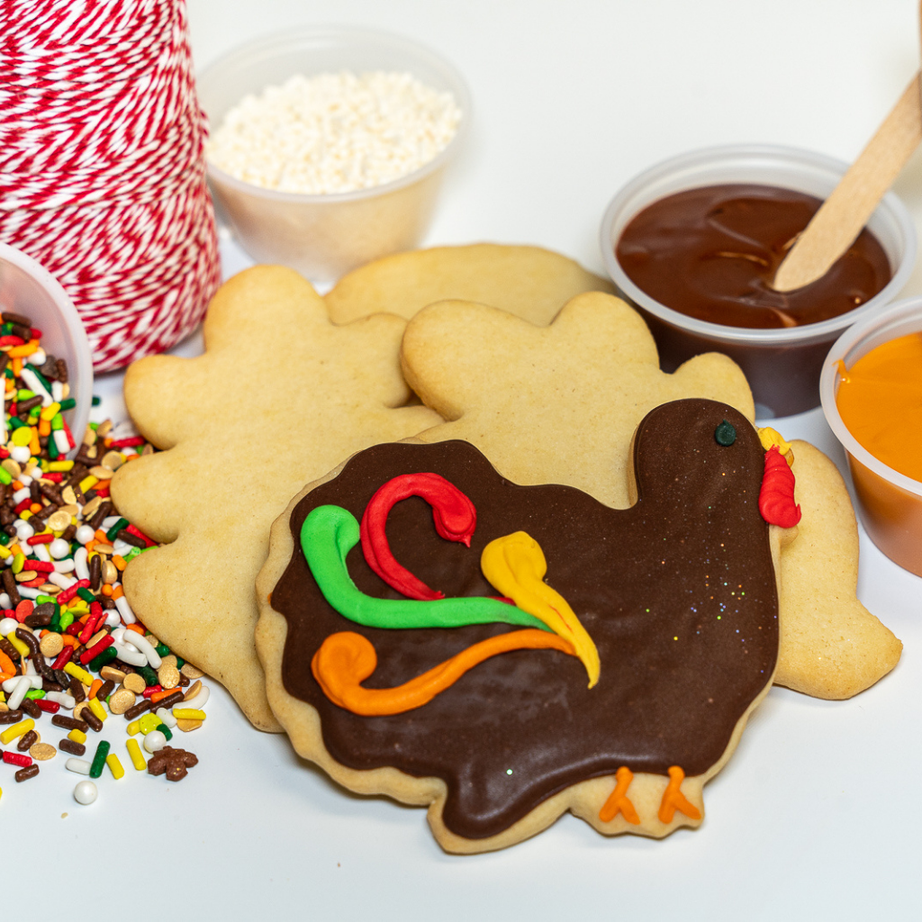 Thanksgiving cookie decorating kit with turkey-shaped cookies.