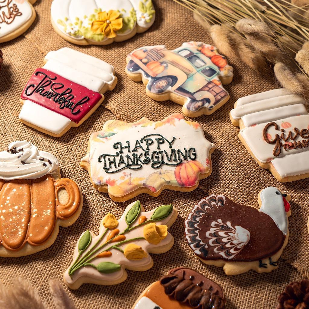 Assorted Thanksgiving butter cookies on a burlap background.