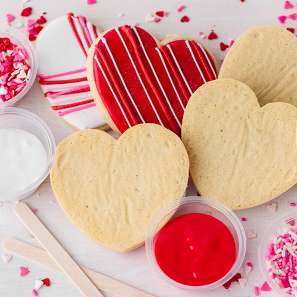 Heart-shaped Valentine's Day cookies with icing and sprinkles.