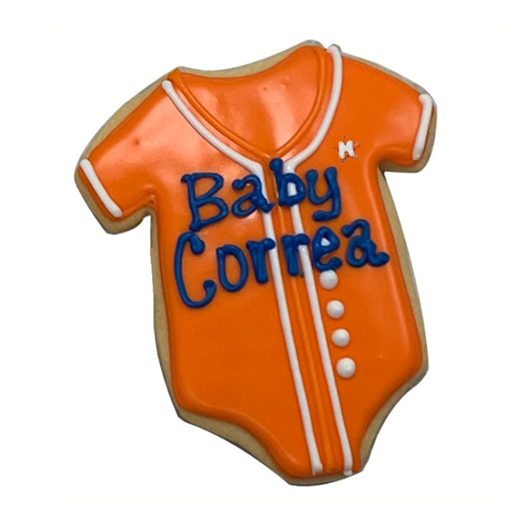 Astros onesie cookie with orange icing and blue lettering
