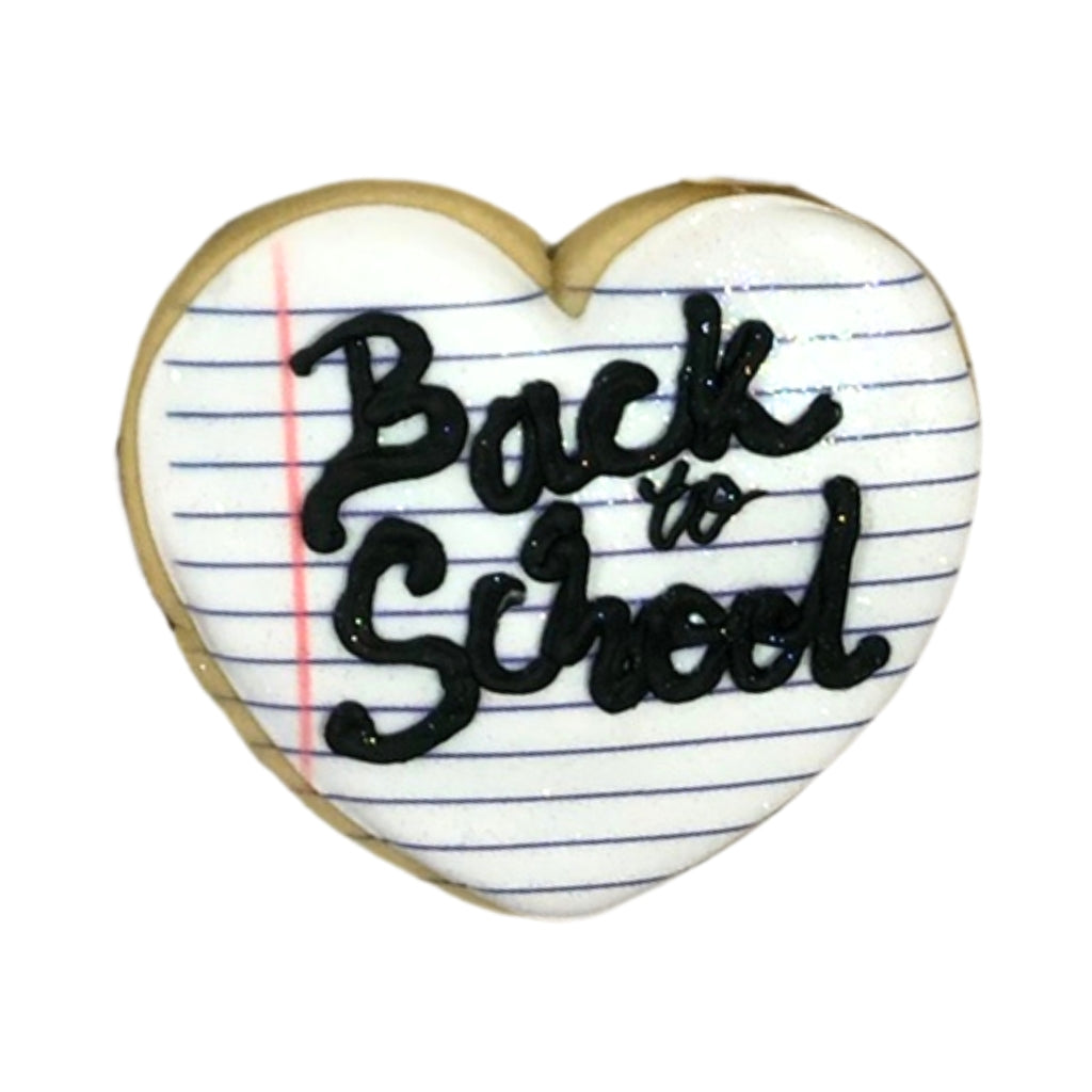 Heart-shaped Back to School cookie with lined paper design.