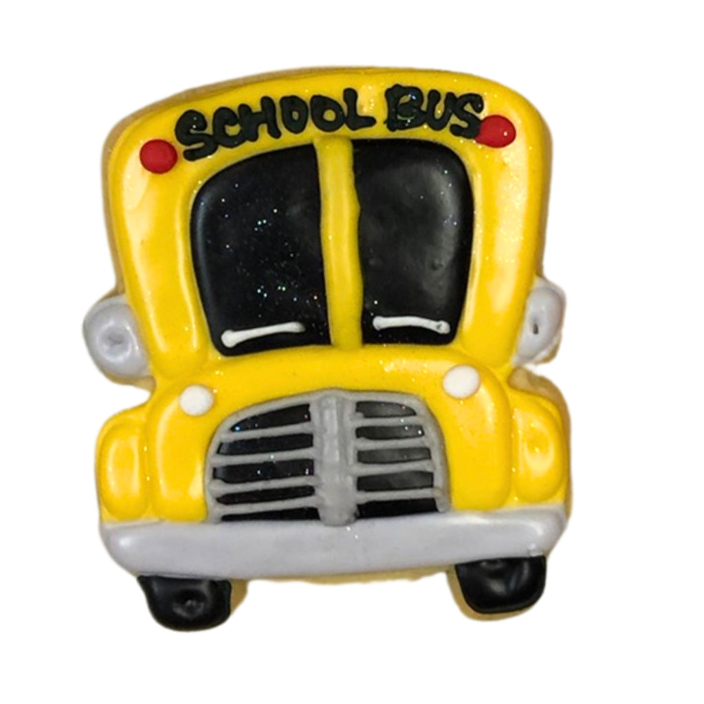 Back to school cookie shaped like a yellow school bus.