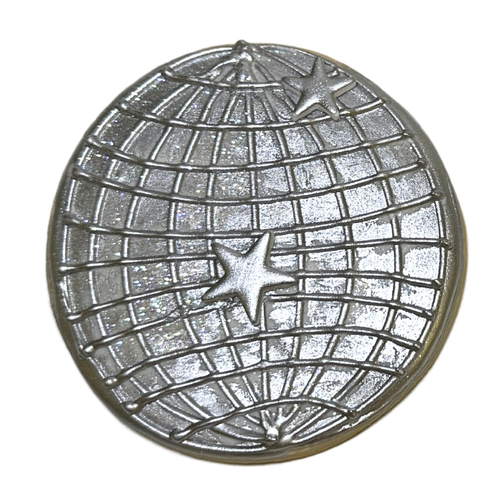 Beyoncé disco ball cookie with silver star accents.