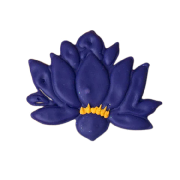 Diwali lotus-shaped cookie with purple icing and yellow detail
