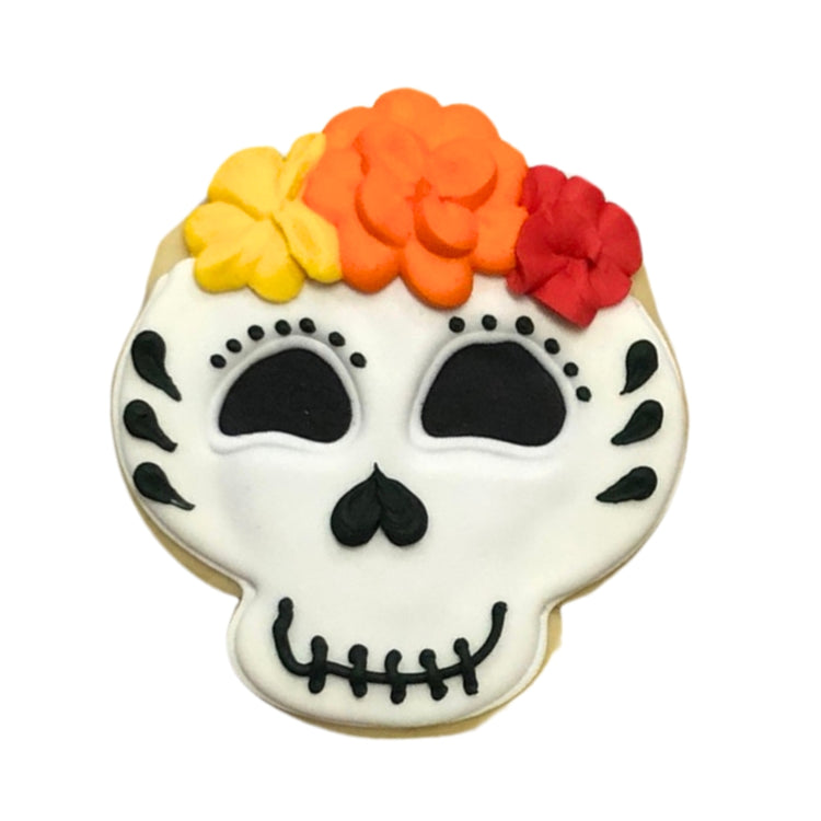 Day of the Dead sugar cookie with colorful floral icing.