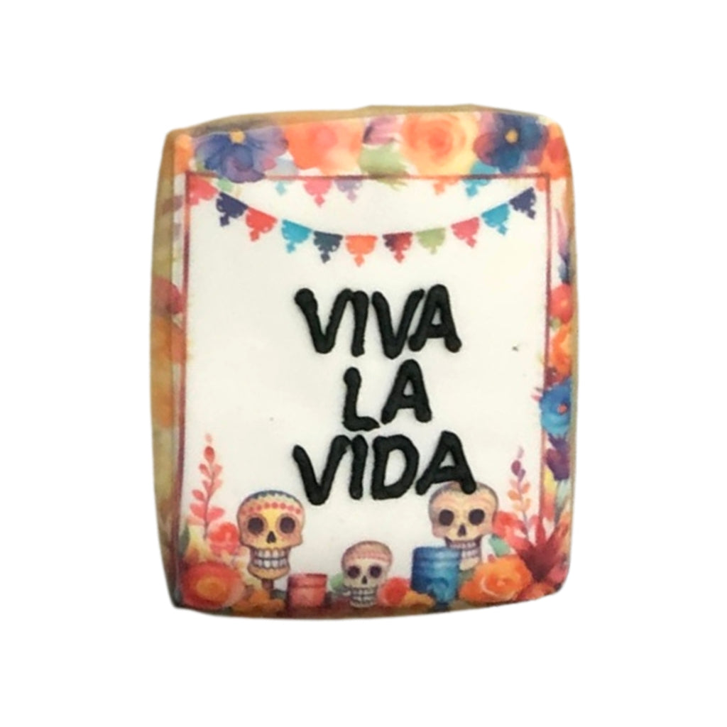 Day of the Dead cookie with Viva La Vida text and sugar skulls.
