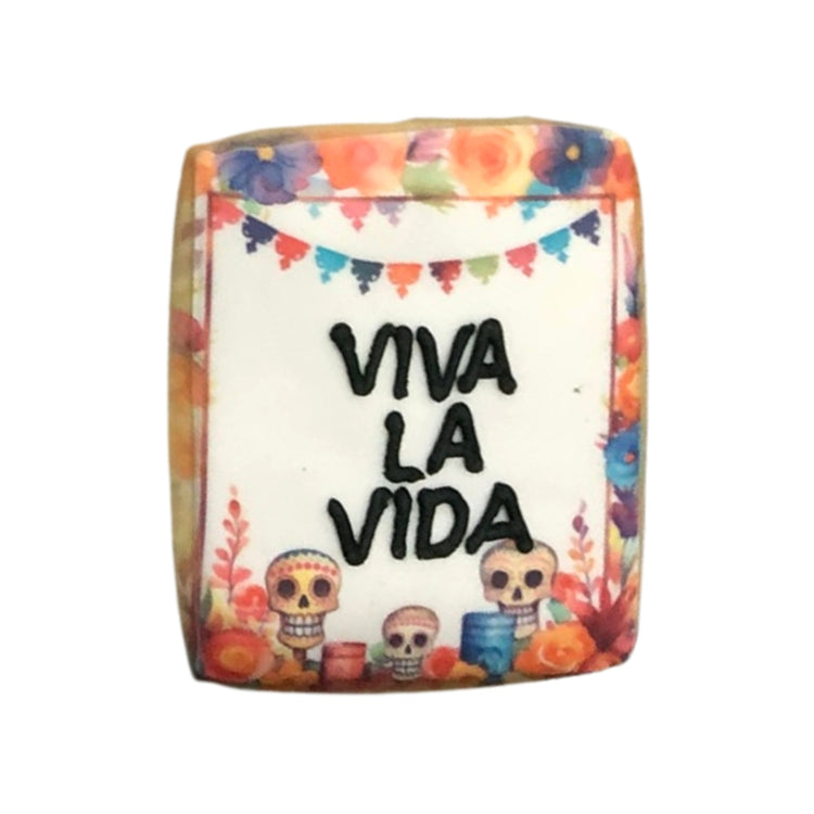 Day of the Dead cookie with Viva La Vida text and sugar skulls.