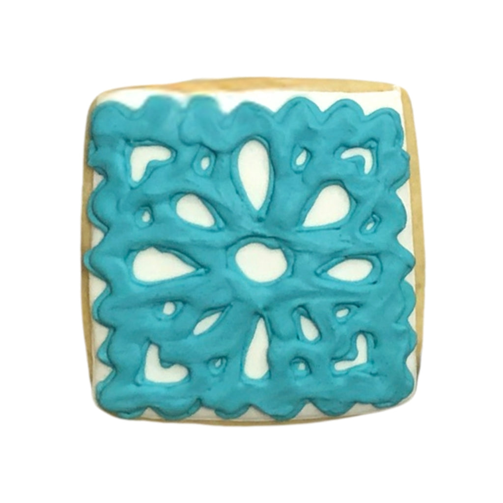 Day of the Dead cookie with blue floral icing design