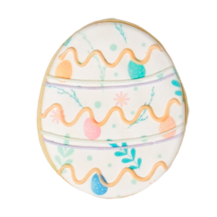 Easter butter cookie shaped like an egg with floral icing.