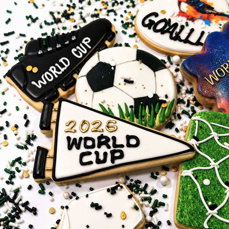 Assorted World Cup cookies with soccer-themed icing designs.