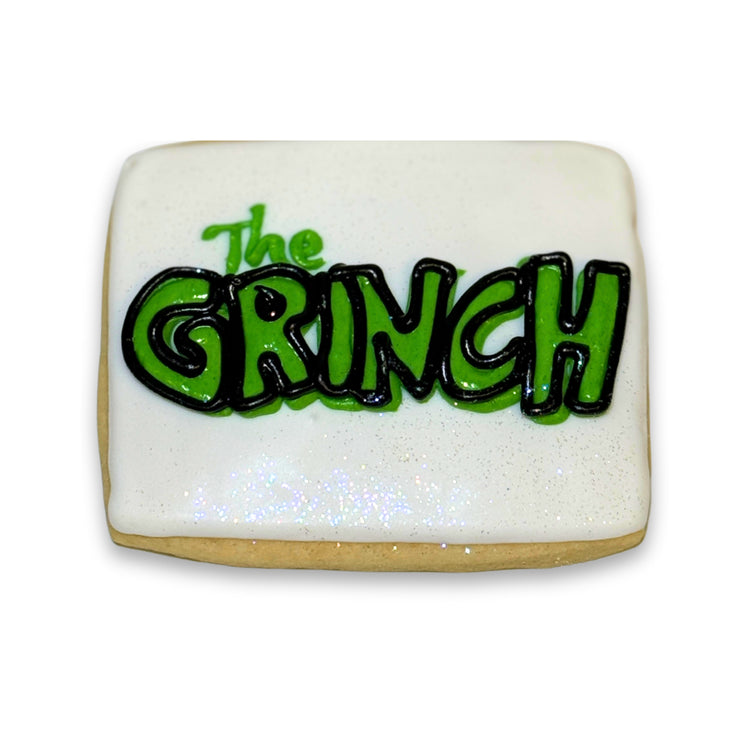 Merry Grinchmas square cookie with green icing lettering