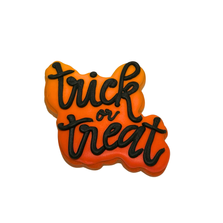 Halloween cookie with orange icing and black script text.