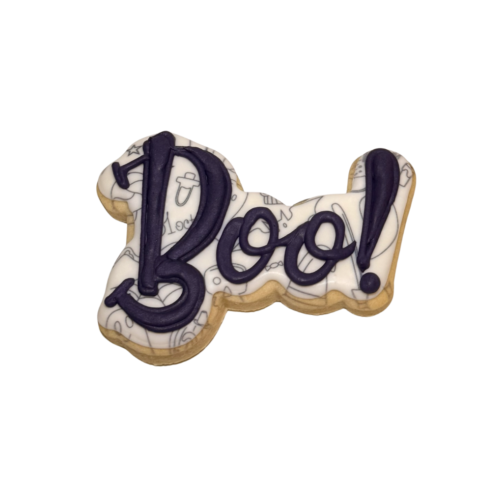 Halloween cookie shaped like Boo with purple icing lettering.