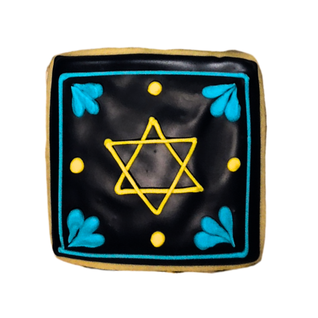 Square Hanukkah cookie with black icing and yellow Star of David